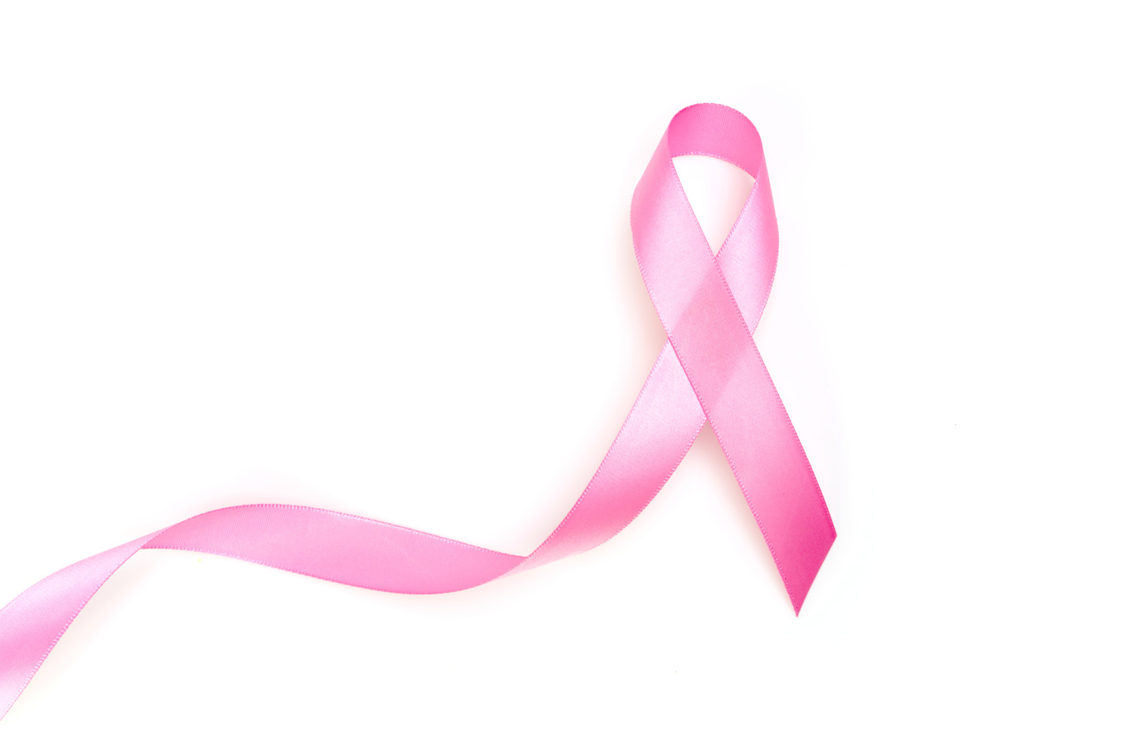 World cancer day : Breast Cancer Awareness Ribbon on white Background .