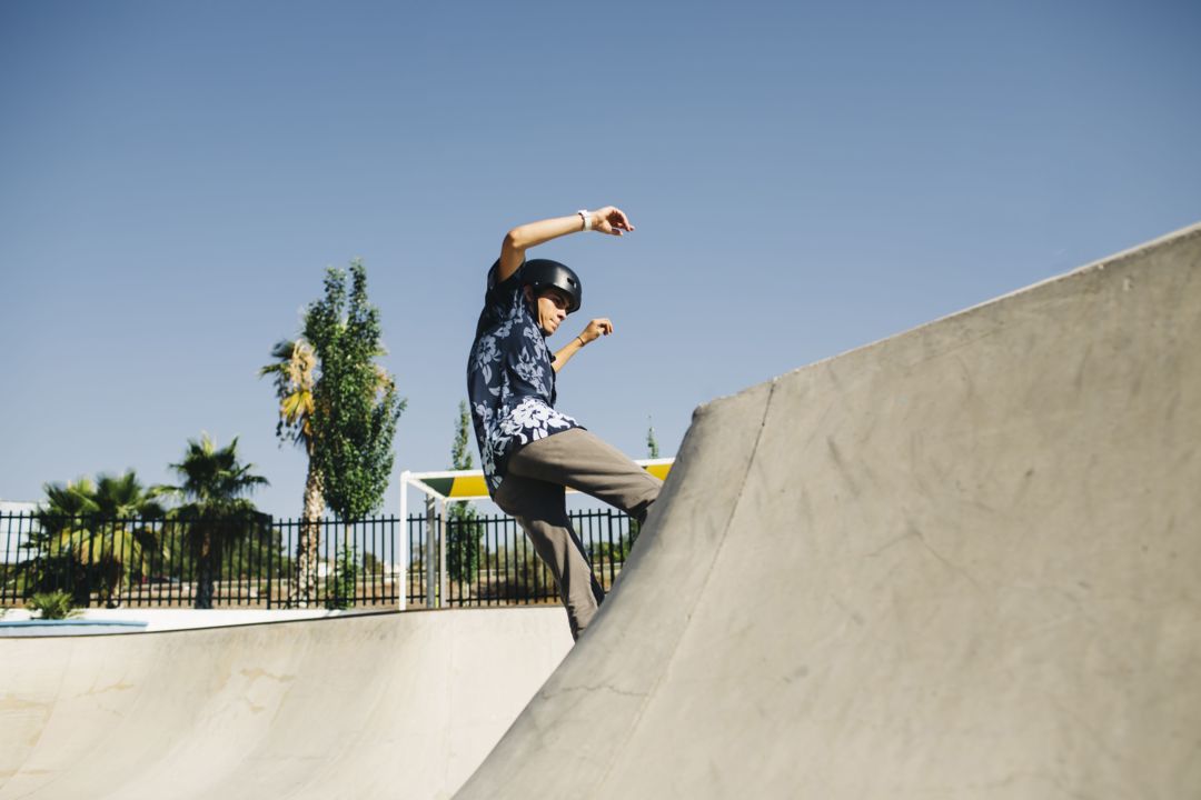 fit-guy-skating-with-helmet-outdoors