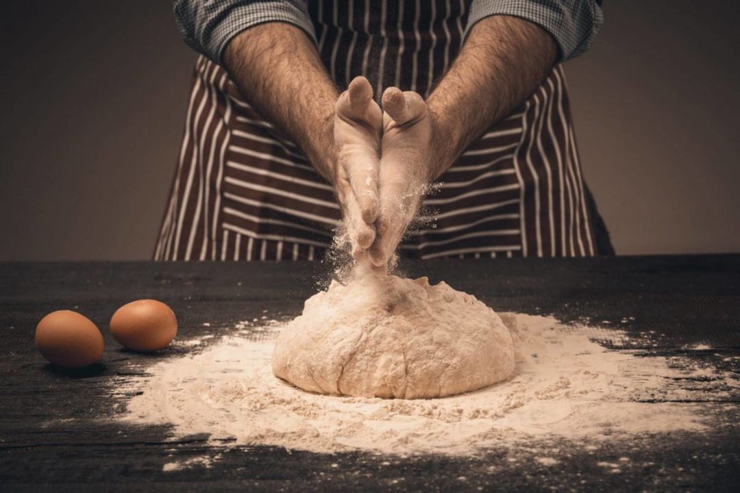 male-hands-knead-the-dough-1200x800