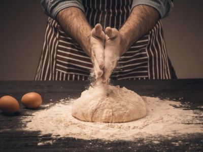 male-hands-knead-the-dough-1200x800